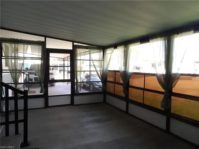 Enjoy mornings and evenings in this screened in sunroom