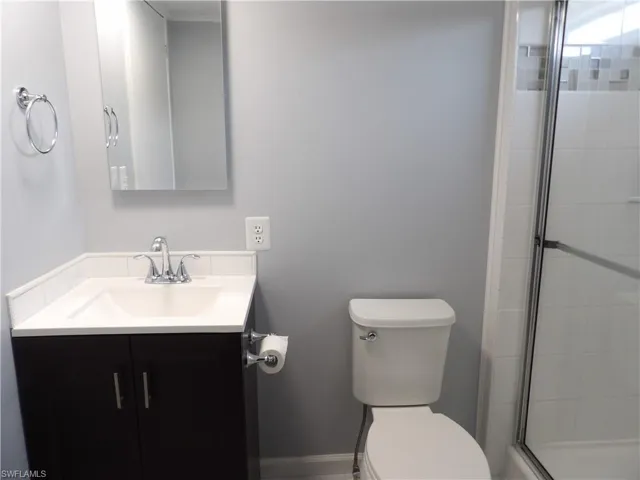 Full bath featuring vanity and a stall shower