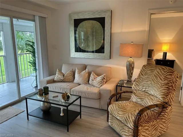Living room featuring light LVP floors