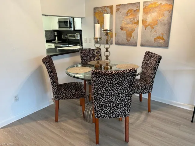 Dining area with light LVP floors