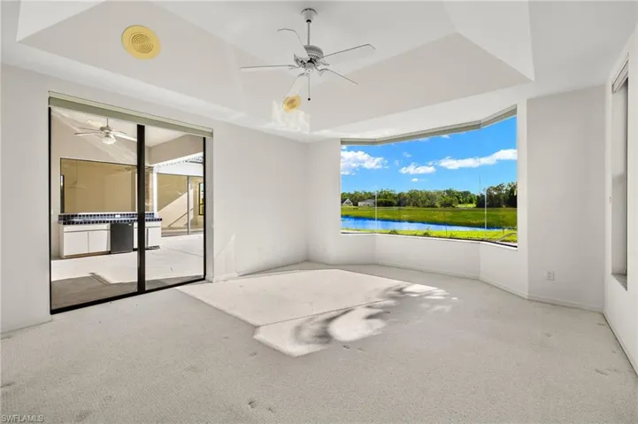 The spacious owner's ensuite boasts an impressive zero corner window and pocketing sliding glass doors that open to the lanai and pool area.