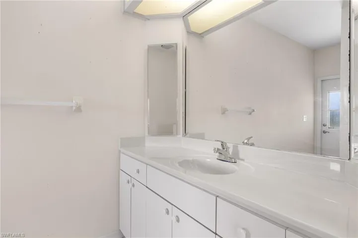 The guest bath also serves as the pool bath, providing convenient access for guests enjoying the pool area.
