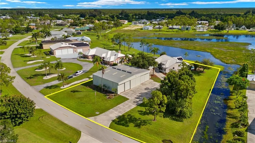 Birds eye view of property with a highlighting the pond and preserve views.