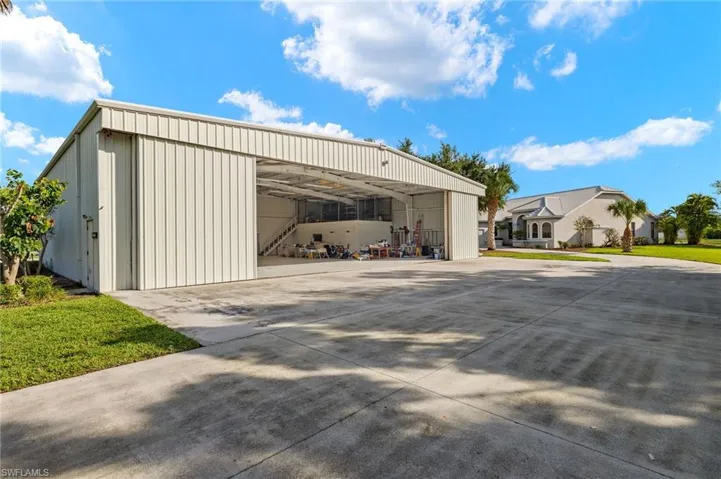 Four sliding panel doors create an opening of 50'x15'6". Hangar is complete with an air conditioned office space, full bathroom and storage room.