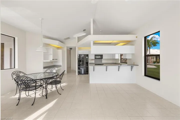 Imagine how open this kitchen space would be if you removed the lofted ceilings?