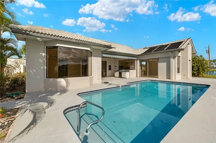 Rear view of house with a patio area.