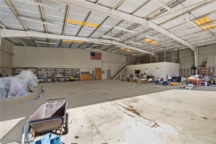 Further storage is available in the mezzanine above the office space.