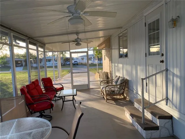 Sunroom with plenty of natural light and ceiling fan