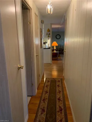 Hallway with light wood-style floors