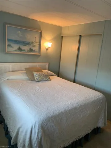 Bedroom featuring a closet and carpet floors