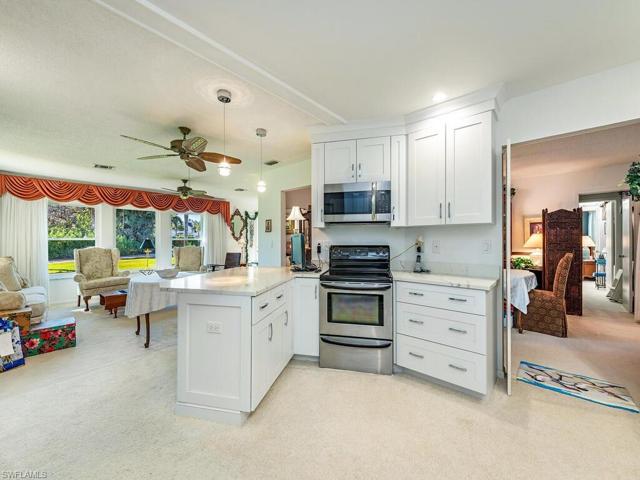 Updated kitchen adjacent to original dining room and formal living room.
