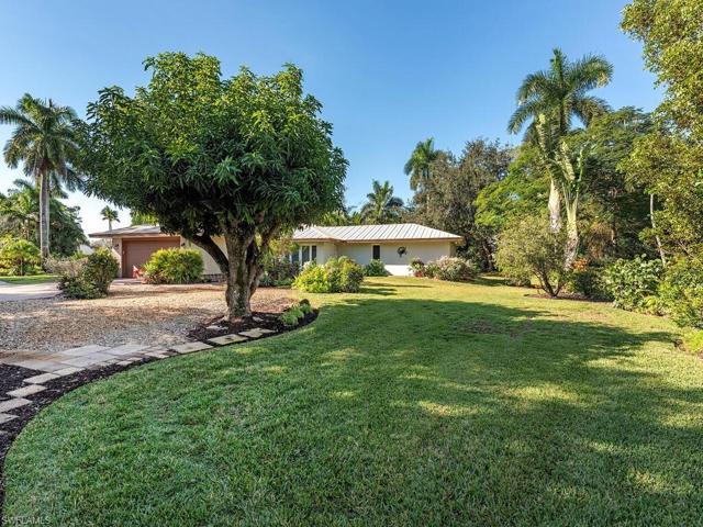 Large well-landscaped lot has ample parking in the rear to the East, and an enclosed two car garage.