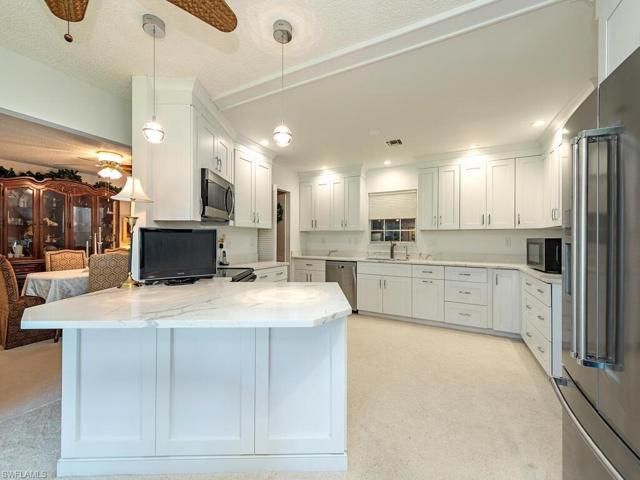 Updated Kitchen with breakfast bar next to original formal Dining Room.