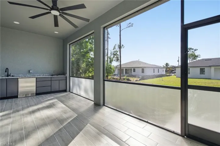 Unfurnished sunroom featuring a sink