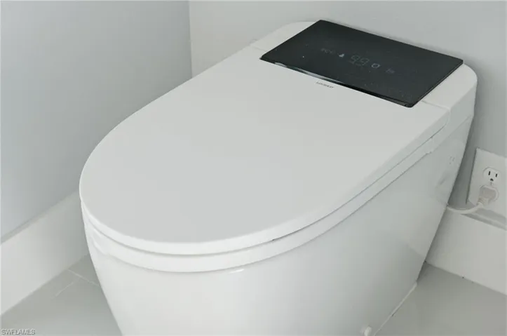 Detailed view of a water softener system and washer / dryer