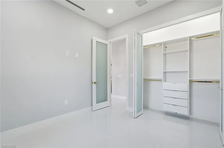 Unfurnished bedroom featuring a closet and recessed lighting