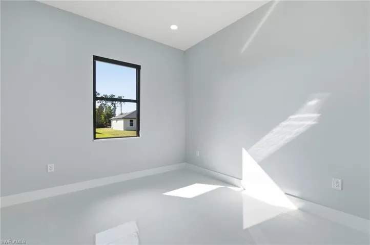 Empty room featuring recessed lighting