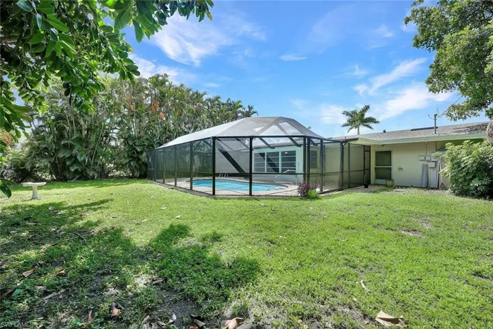 View of yard with a lanai