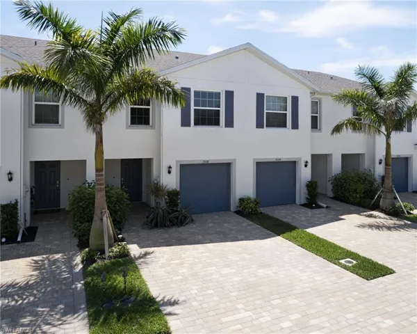 Townhome / multi-family property with a garage