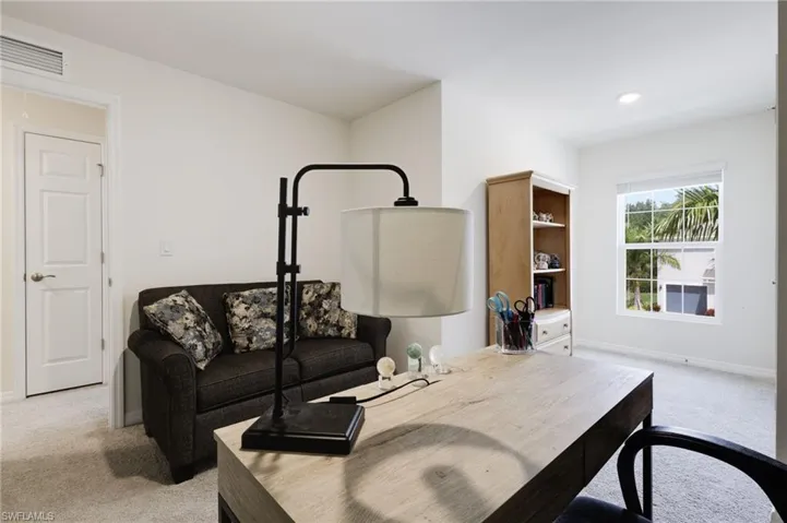 Living room featuring light colored carpet