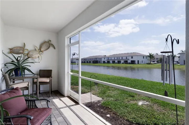 Sunroom / solarium with a water view