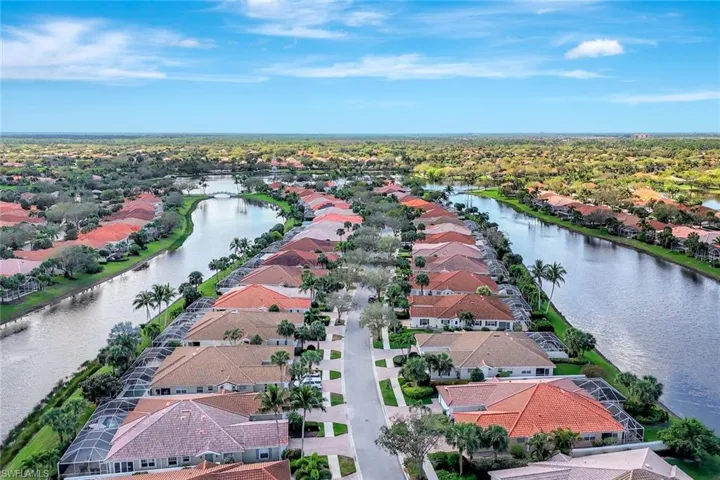 Drone / aerial view with a residential view and a water view