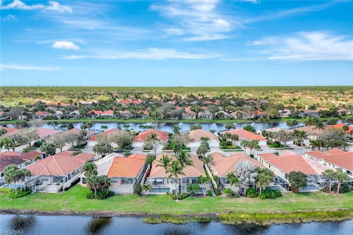 Drone / aerial view featuring a water view and a residential view