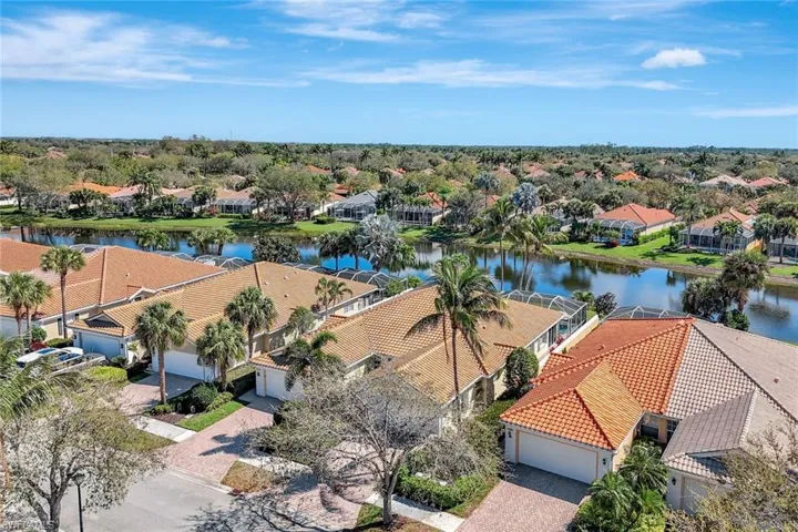 Drone / aerial view with a water view and a residential view