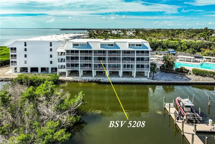View of property with a water view