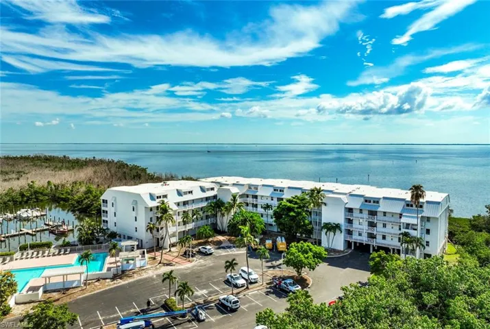 Birds eye view of property with a water view of Pine Island Sound and the Bayside Marina