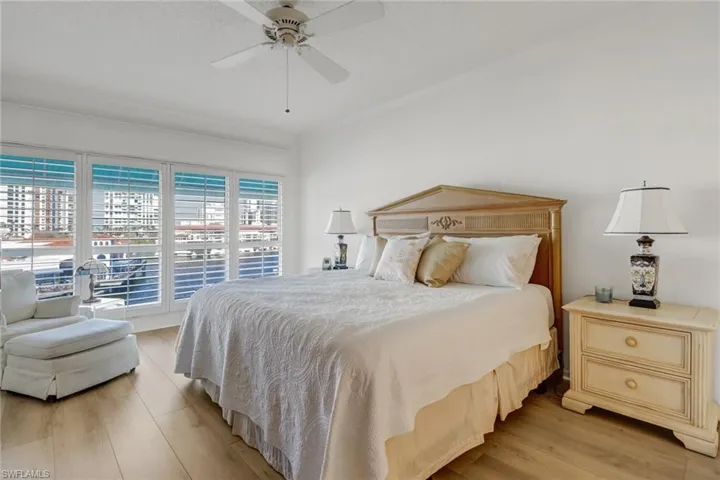 Bedroom with light wood-type flooring and a ceiling fan