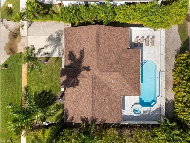 View of subject property featuring a pool