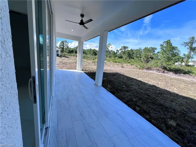 View of patio featuring ceiling fan