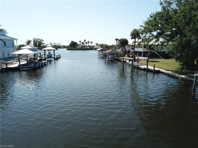 View of dock featuring boat lift and a water view
