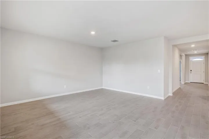 Empty room featuring light wood-type flooring