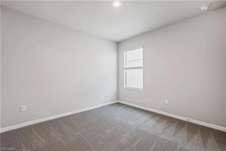 Empty room with carpet flooring