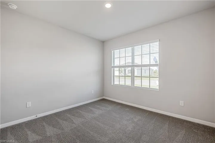 Unfurnished room featuring carpet