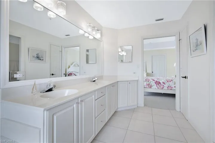 Bathroom featuring tile patterned flooring and vanity