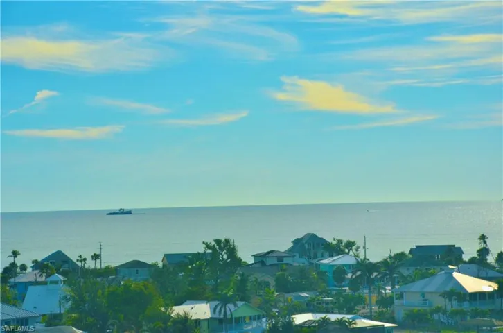 Day time view of Gulf from lanai and living area