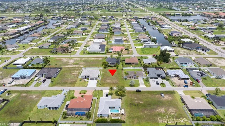 View of property location with nearby suburban area and a large body of water