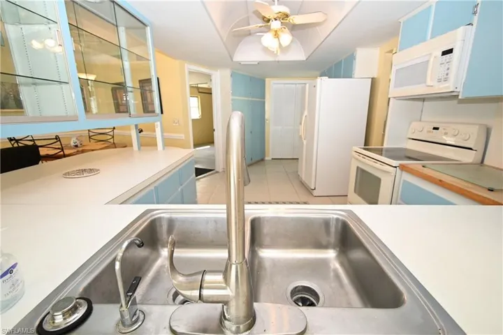 Double basin stainless steel sink with a brushed nickel faucet