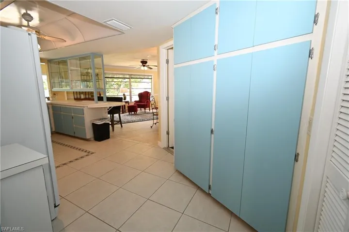 Built-in blue cabinetry providing extensive storage