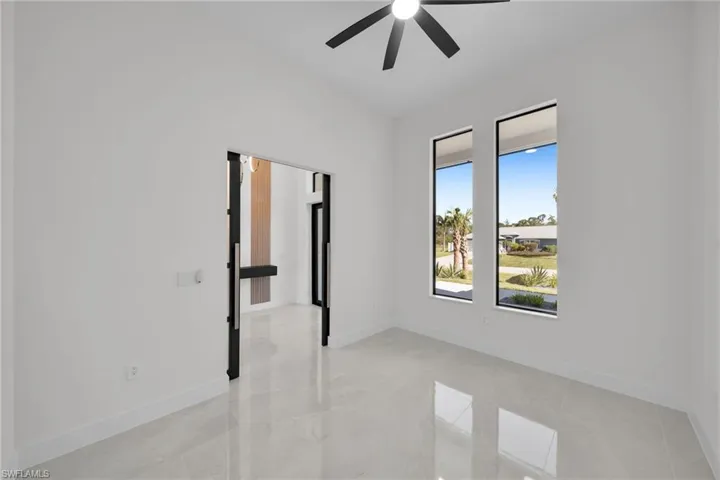 Unfurnished room featuring ceiling fan
