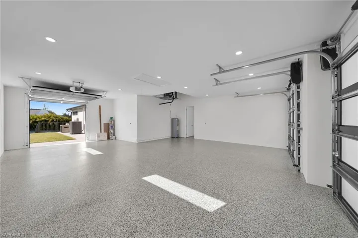 Garage with a garage door opener and water heater