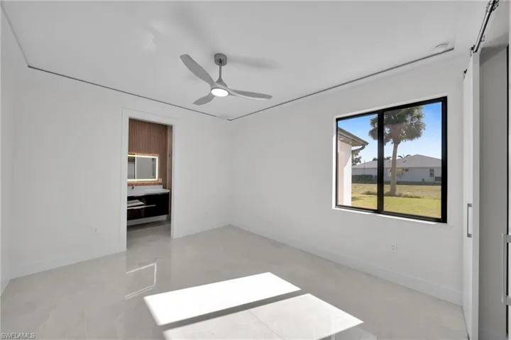 Unfurnished bedroom featuring ceiling fan