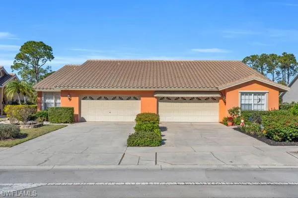 View of front of property featuring a garage