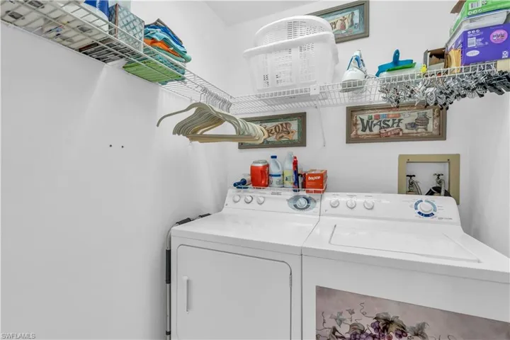 Washroom featuring washer and clothes dryer