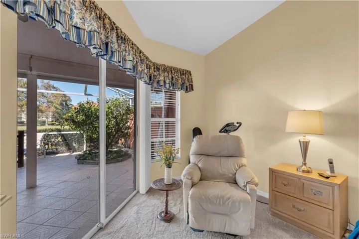 Living area with light carpet