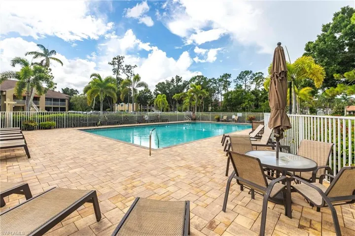 Community pool with a patio area