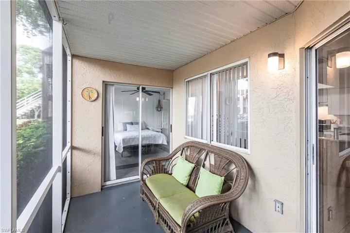 Sunroom / solarium featuring ceiling fan